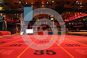 Room in casino with table for roulette game photo