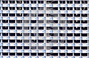 Room cells of many storeyed building structure. Black and white abstract building exterior texture and background with