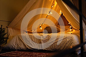 room of children empty tent lodge in the evening before going to bed.