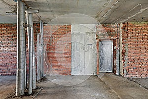 Room with concrete and brick walls, concrete ceiling and floor
