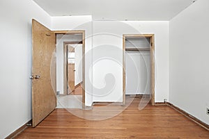 Room with a door open and a closet