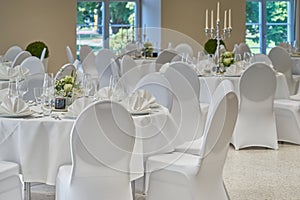 Room with festively bright tables covered in white