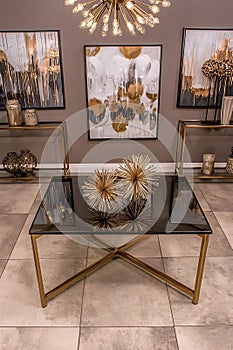 Room with a gold and black table with a gold and black frame
