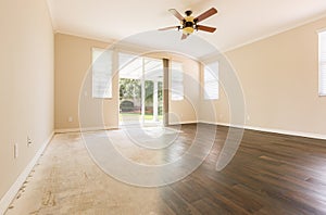 Room with Gradation from Cement to Hardwood Flooring photo