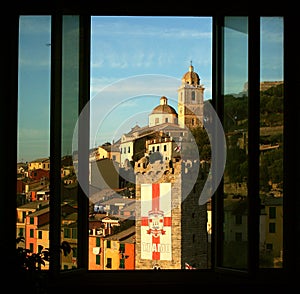 Room hostel with window overlooking the buildings tower and cathedral of Portovenere