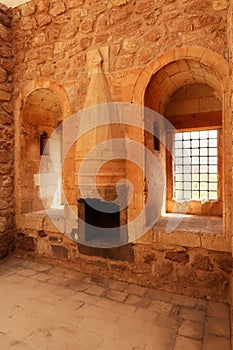 Room inside the ottoman Ishak Pasha Palace, Sarayi, barred windows and a traditiona chimney, Dogubeyazit, Turkey