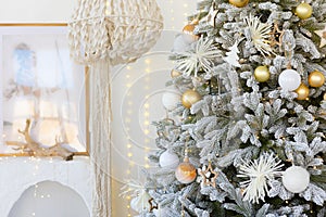 room interior with Christmas tree decorated with golden balls toys on blurred, sparkling and fabulous fairy tale background with