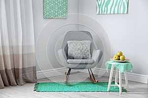 Room interior with comfortable armchair. Mint color decors photo
