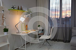 Room interior with comfortable workplace near window. Design idea