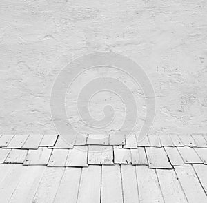 Room interior: grey old painted cement wall with wooden floor