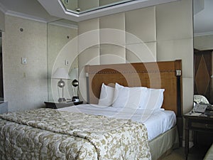 Room with king-size bed and on ceiling mirror
