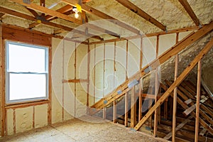 A room at newly constructed home is sprayed with liquid insulating foam