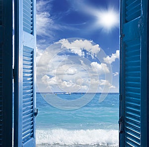 Room with open door to seascape