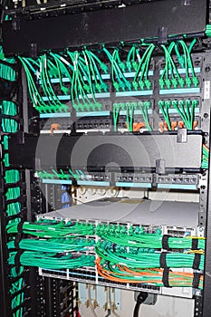 IT room rack with server equipment and cables