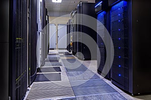 Room with rows of server hardware in data center