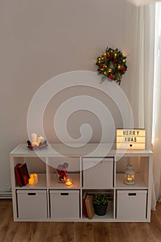 room with shelf decorated for christmas at home