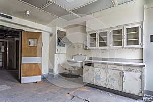 Room with sink in an abandoned hospital