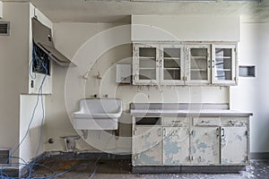 Room with sink in an abandoned hospital