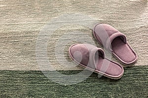 Room Slippers are on a soft rug, the concept of comfort and convenience