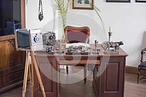 Room in the style of the 19th century. desk in the office, the old camera.