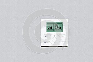 Room thermostat on wall. Modern digital thermostat on beige background with copy space.