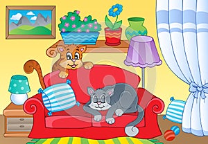 Room with two cats on sofa