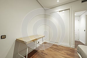 Room of a vacation rental house with reddish oak parquet flooring