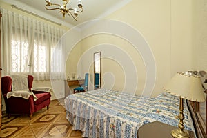 Room with vintage and gaudy-looking furniture and bed