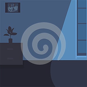 Room with a window at night.