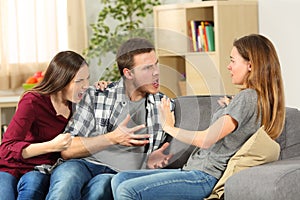 Roommates arguing and shouting at home photo