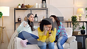 Roommates gossiping behind back of depressed woman