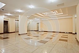 Roomy hall of modern residential building photo