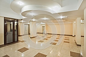 Roomy hall of modern residential building photo