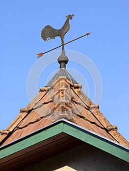 Rooster weather vane on the roof