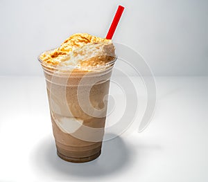 Root Beer Float drink with a red straw on a white background.