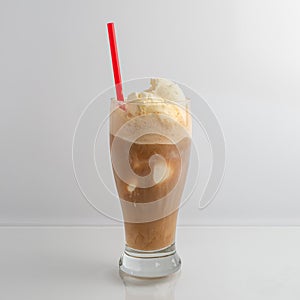 Root Beer Float drink with a red straw on a white background.