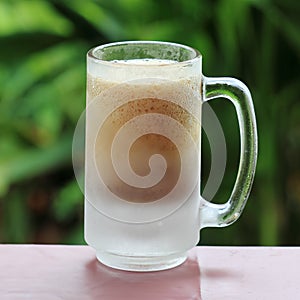 Root beer and foam