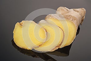 Root Ginger sliced on dark