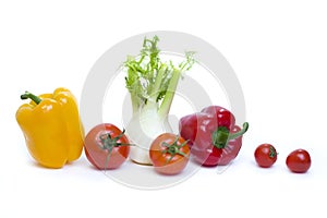 Root of parsley of red pepper with yellow pepper and tomatoes on