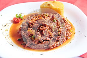 Ropa vieja, a very popular traditional Cuban dish, made with shredded beef, vegetables, tomato, peppers and onions, in Camaguey photo