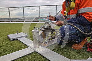 Rope access engineer conducting monthly safety inspecting on portable lightweight abseiling tripods system