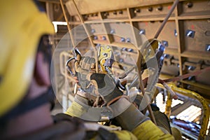 Rope access miner commencing rope transferring using descender maneuvering from left to right