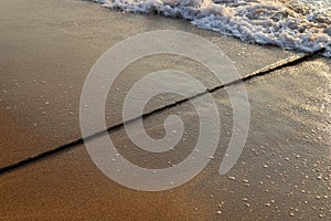 Rope on the beach to enclose a permitted swimming spot