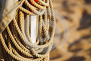 Rope On Boat`s Deck. Hanging rope wool close-up on blurred background. marine rope. Ship Rope