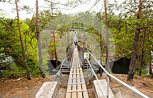 Rope bridge in the National Park Repovesi, Finland.