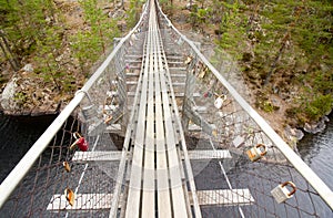 Rope bridge in the National Park Repovesi, Finland.