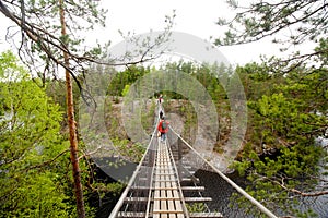 Rope bridge in the National Park Repovesi, Finland.