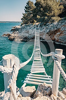 Rope bridge over a cliff in Punta Christo, Pula, Croatia - Europe. Travel photography, perfect for magazines and travel photo