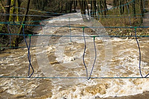 Rope bridge over the fast river, training for survival skill