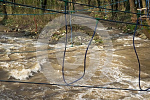 Rope bridge over the fast river, training for survival skill